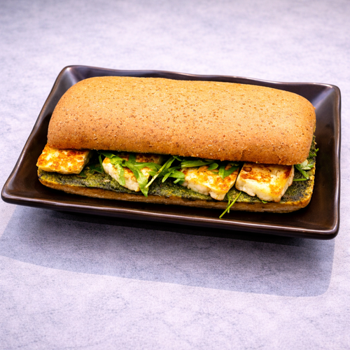 Halloumi sandwich with pesto sauce and arugula